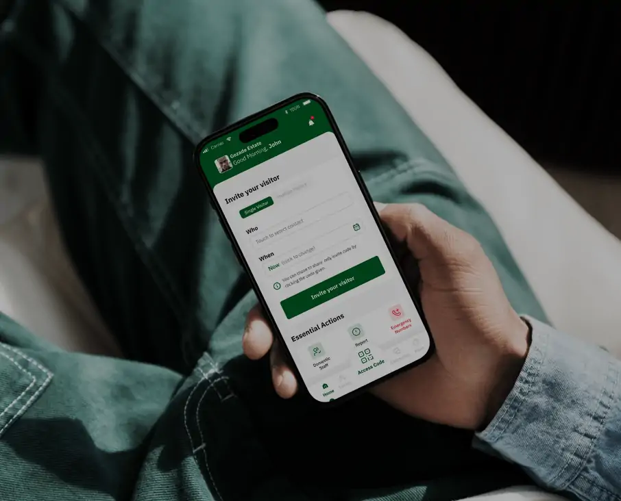 A person holding a smartphone with Sylogate's Resident Application open, showing options for visitor management, access codes, and community updates for seamless estate living.