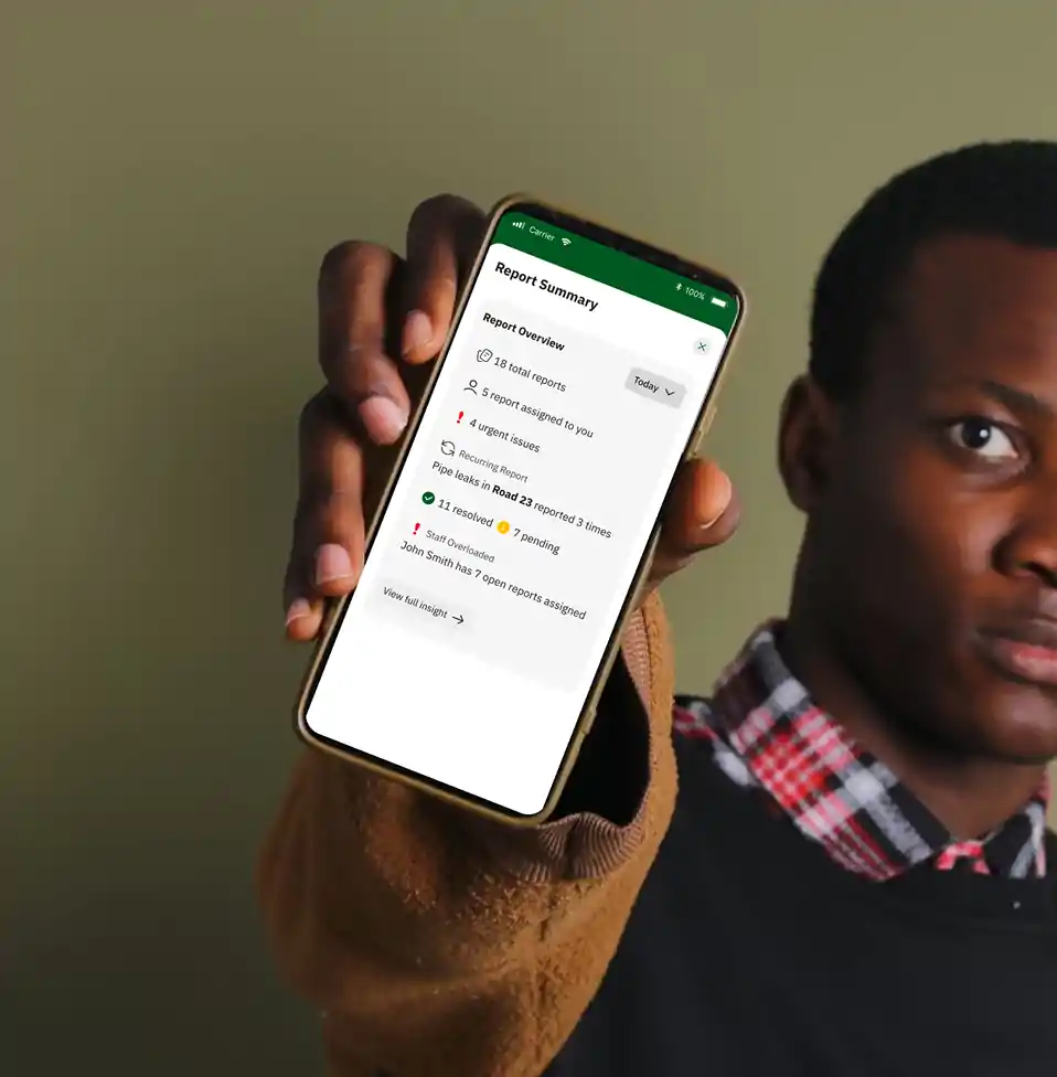 A close-up of a security staff member using the Sylogate Staff Application on a smartphone, verifying visitor credentials and monitoring estate access for enhanced security management.